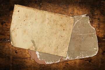 Aged weathered papers on wood