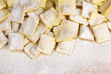 Fototapeta na wymiar Italian pasta, ravioli sprinkled with flour