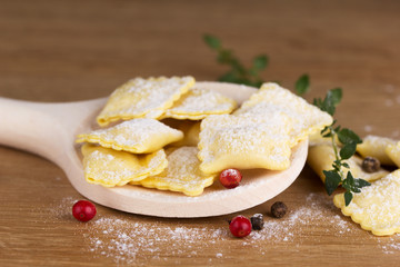 Italian pasta, ravioli with flour eggs and greens