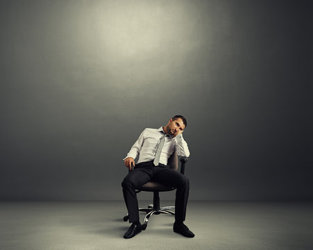 bored businessman sitting in the room