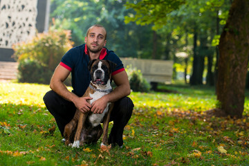 Close-Up Of A Young Man With His Dog