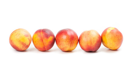 Ripe peaches fruits isolated on white