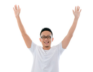 casual asian man with hands raised eyes closed