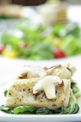 Fish meat with champignon mushroom