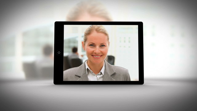 Video showing tablet displaying business people