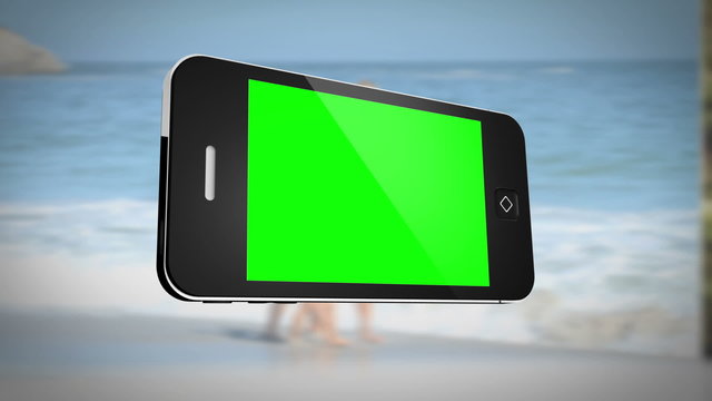 Smartphone with green screen in front of family outdoors