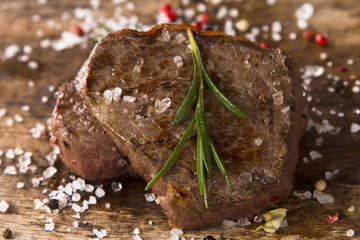 Grilled steaks on wood