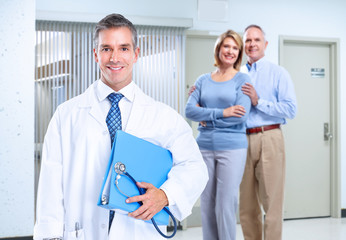 Smiling medical doctor man and family.