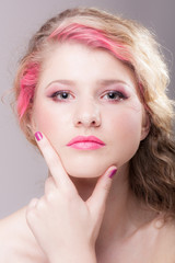 Attractive woman with colorful makeup and hairstyle