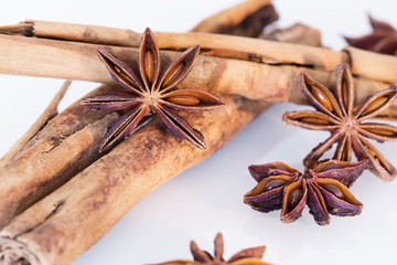 Star anise and cinnamon on a white background