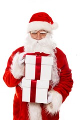 Santa Claus with gift boxes isolated on white background