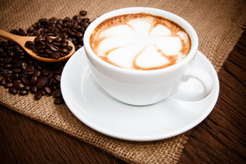 Coffee cup and saucer on a wooden table