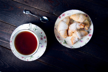 Croissant with jam and tea for breakfast