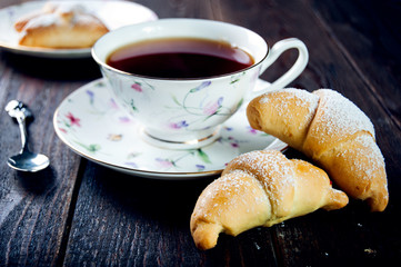 Croissant with jam and tea for breakfast