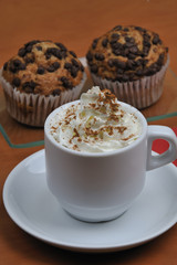Viennese coffee with cinnamon and chocolate muffins