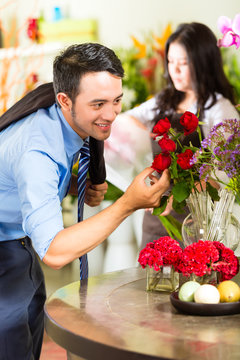 Saleswoman and customer in flower shop
