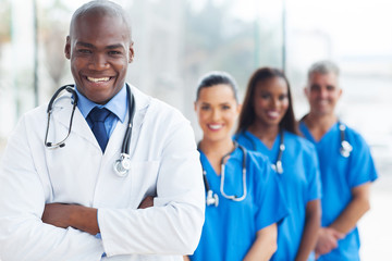 african medical doctor and colleagues in hospital