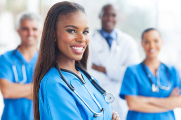 african female nurse with colleagues