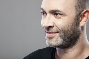man looking to the left isolated on gray background with copyspa