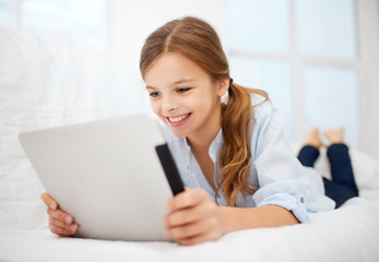 girl with tablet pc at home