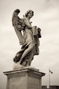 One of the angels at the Sant' Angelo bridge in Rome, Italy