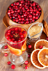 Hot mulled wine with cranberries and orange