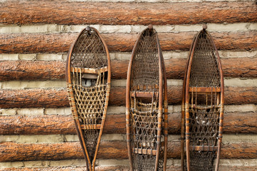 Snow shoes and a log cabin