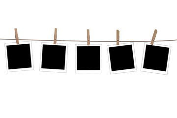 Blank photographs hanging on a clothesline