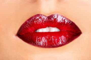 Fototapeta premium Macro photo of a red woman's lips
