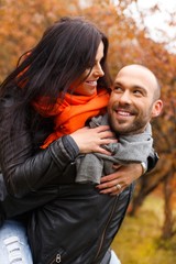 Fototapeta premium Happy middle-aged couple outdoors on beautiful autumn day