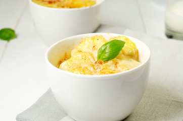 Potato gratin in the white bowls