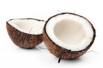 Cracked coconut on white background