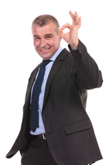 business man shows the ok sign