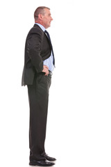 side of business man with hands on hips