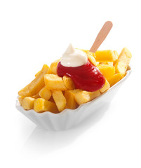 Golden fried potato chips with ketchup and mayo