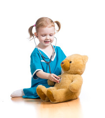 child playing doctor with toy