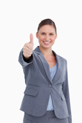 Thumb up given by smiling saleswoman