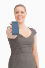 Fototapeta premium Smartphone being showed by a woman