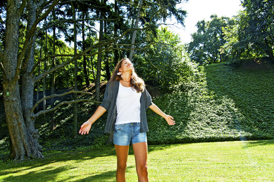 Young laughing girl in the par