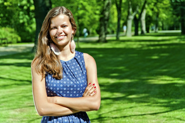 Obraz premium beautiful young brunette woman outdoor on the meadow on a summer