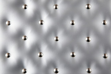 Leather upholstery. Silver leather with silver buttons