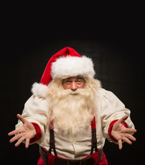 Santa Claus portrait expressing gesturing and presenting somethi