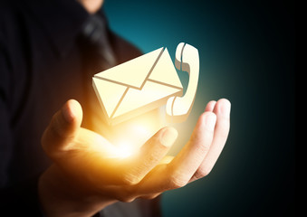 Contact us symbol in businessman hand, Email icon