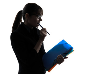 business woman focused  holding folders files silhouette - Powered by Adobe