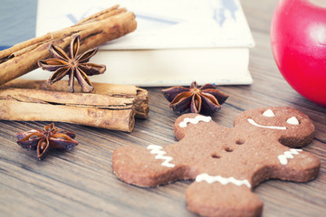 Gingerbread man, cookies, star anise, cinnamon and cookbook