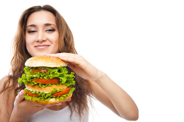 Happy Young Woman Eating big yummy Burger isolated