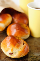 Sultana Buns in a Paper Bag with a Cup of Coffee, copy space for