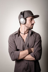 young stylish man listening to music