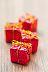 Decorative gifts on wooden background