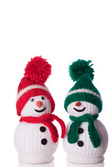 couple of snowman with red and green hat and scarf